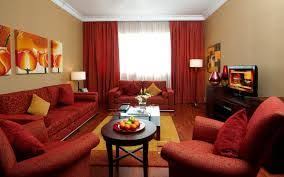 To create a unified design, look for ways to incorporate other small burgundy accents throughout the room. Curtain Color To Match Burgundy Wall Color In Living Room Modern Architecture