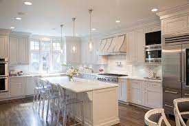 A kitchen island can make a kitchen more functional — but knowing how much of an overhang is if you have a taller island and, therefore, a taller stool, you'll likely rest your knees at a lower angle. Island With Ghost Stools Transitional Kitchen Cozinha Designer De Interiores