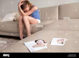 Lonely wife suffering after breakup at home Stock Photo - Alamy