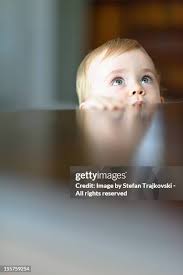 Cute Toddler In His Crib High-Res Stock Photo