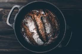 Preheating dutch oven in oven for homemade bread. 3 Ways To Make Amazing Sourdough Bread Without A Dutch Oven Truesourdough Com