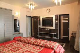 Home designing blog magazine covering architecture, cool products! Master Bedroom With Tv Unit Hinged To Wooden Cabinet By Sudeep S Gandhi Id