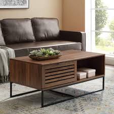 Two spacious drawers provide space for remotes, game controllers, chargers, and more, while the unique magazine holder keeps reading materials right within reach. Walker Edison Furniture Company Modern Slatted Wood Rectangle Coffee Table With Drawer Living Room Ottoman Storage Shelf 42 Inch Dark Walnut