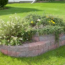 This brick border divides the flowers from the lawn and helps them to stand out. Garden Edge Classic Wedgestone Shaw Brick Concrete Curved