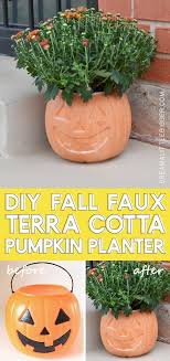 I got started by pulling out leftover wrapping paper from last christmas and an old plastic pumpkin bucket from a halloween passed that was sitting around in the garage. Jack O Lantern Pumpkin Terra Cotta Pot Tutorial