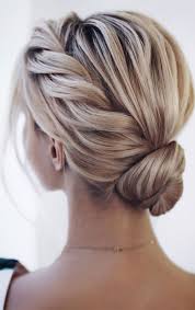 A protective style bun combined with front twists and a puff looks very sophisticated. Bridal Hairstyles That Perfect For Ceremony And Reception Twisted Updo