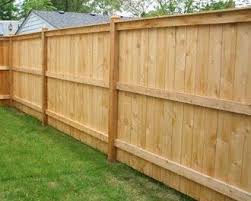 Cedar boards expand and contract throughout the seasons, causing some gaps between boards on a standard privacy fence. Pinecrest Fence Company Philadelphia Residential Wood Fencing Company