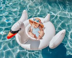 Lexie On Instagram Everly S First Pool Day Pool Photoshoot Summer Baby Swan Pool Float Baby Fashion Baby Float Baby Fashion Summer Baby Swan