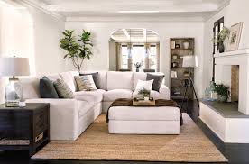Naples beach coastal retreat series living room. Bowen Sectional Ottoman This Cream White Sectional Is Spacious Enough For Sprawling Out W Living Room Furniture Layout Coastal Living Rooms Home Living Room