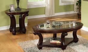A coffee table set will usually include a larger coffee table that you can put in front of your sofa along with one or two smaller end tables. Perseus Glass Top Wooden Coffee Table Set Montreal Xiorex