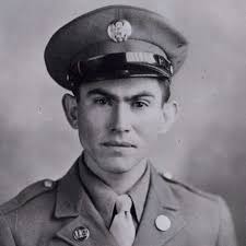 Gunner Kenneth Bratton, wounded in the knee by shrapnel, being pulled out  of the turret of a TBF Avenger aircraft aboard USS Saratoga after a  successful raid