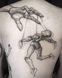 Puppet tattoos tattoo ideas artists and models. Sketch Work Style Puppet Tattoo On The Back