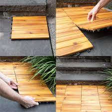 Having a deck style and lumber elements all around, it makes sense that the patio floor is covered by wood. Amazon Com Villa Acacia Wood Patio Pavers Interlocking Deck Tiles For Outdoor And Floors 12 X 12 Inch Pack Of 10 4 Per Slat Home Improvement