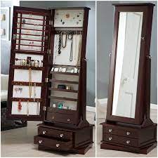 This satin white jewelry organizer is crafted of faux wood and has a large 43 in x 11 in mirror and 4 tiers with trays, hooks and rods to store all your treasures with ease. Furniturer Jewelry Armoire Wooden Cabinet With Mirror Free Standing Jewelry Storage Organizer For Home Dark Brown Jewelry Boxes Organizers Clothing Shoes Jewelry Amaltheiayada Gr