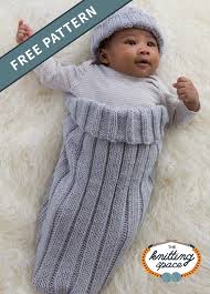 Tuck the hat in with a new baby gift or make for your favorite charity. Comfy Knitted Cocoon And Cap Free Knitting Pattern