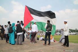 A palestinian woman walks carrying a child past wreckage of mobile homes destroyed by israeli palestine has no comprehensive domestic violence law to prevent abuse and protect survivors. Year Ender 2020 Indonesia Firm On Palestine Question Antara News