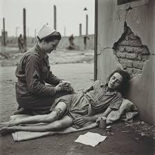 May 12, 1945 — Bergen-Belsen, Germany After the liberation, British nurses  began cleaning the camp. A survivor named Ruth volunteered to help, even  though she could barely walk. When asked why, she