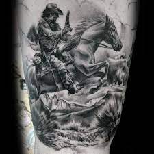 Cowboy riding horse tattoo