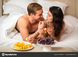 Couple Eating Fruits In Bedroom Stock Photo By C Denisfilm 136410836