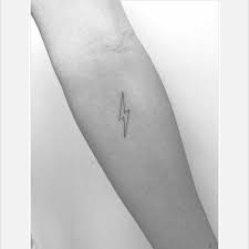 We've curated 55 of the best lightning tattoos from talented tattooers around the world, take a peek at these electrifying pieces in the gallery below. Minimalist Lighting Bolt Tattoo In Fine Line