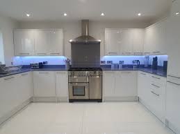 Check spelling or type a new query. White High Gloss Kitchen With Range Oven Grey Mirror Chip Quartz Worktops And High Gloss Tiles F High Gloss Kitchen Gloss Kitchen Cabinets Kitchen Room Design
