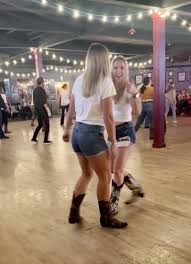We're blonde country girls - we love line dancing in matching Daisy Dukes  and cowboy boots | The Sun
