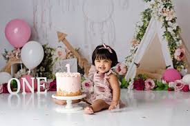 This 1st birthday cake was done for a one year old who loves flowers and butterflies. Cake Smash Photography Belfast Lisburn Northern Ireland Co Antrim Co Down