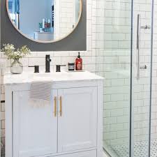 It also has a floating vanity with white countertops and a sink by the side. Stunning Tile Ideas For Small Bathrooms