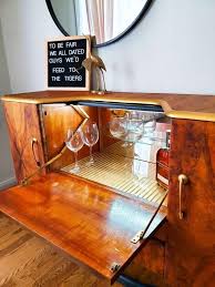 Store your beloved wines with this modern server to have them ready anytime. Art Deco Drinks Cabinet Drinks Cabinet Bar Stool Makeover Rustic Backsplash