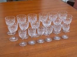 Sold at Auction: Selection of Stuart Clifton Park Crystal glasses,  thumbprint design comprises of 12 medium sized glasses 10.5 x 6 and 6 small  size 8.5 x 4