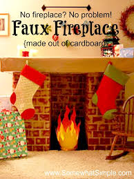 Create a diy faux fireplace mantel with a few pieces of wood, wallpaper and paint! Diy Cardboard Faux Fireplace Easy Instructions Somewhat Simple