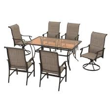 A table (for 6) has a round top and 3 thick upright square legs. Transitional Seats 6 People Patio Dining Sets Patio Dining Furniture The Home Depot