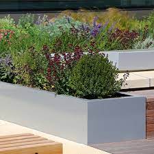 Extra large outdoor planters in the uk are available in styles that are rustic, modern, contemporary trough planters sometimes feature attached wall trellises that you can use to train your climbers. Large Trough Planters