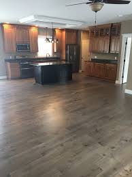 Maple cabinets in praline are highlighted by glass doors and wine storage in this warm and comfortable kitchen. Kraftmaid Praline Maple Cabinets With Black Onyx Glaze Quartz Laneshaw Countertop And Hallmark Slate Appliances Kitchen Kitchen Remodel Kitchen Remodel Design