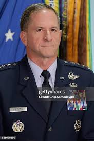 U.S. Air Force Chief of Staff Gen. Mark Welsh III talks with friends...  News Photo