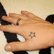 All love and dreams immortalized on hands with hearts and stars tattoo. Star Tattoo On Hand