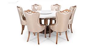 The shadow play dining table features a sleek glass tabletop mounted on a modern metal base with a burnished silver finish. Royaloak Kalpa Six Seater Round Marble Dining Table Set Brown Amazon In Furniture