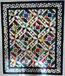 I am so thrilled with how this CROSS CREEK quilt turned out. I made it  bigger- between the lap and twin size 4x5 layout. I ended up using the deep  blue fabric