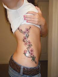 Rib tattoos come in all shapes and sizes and can portray almost anything. 15 Cool Rib Tattoos Awesome Rib Cage Tattoo Designs For Girls