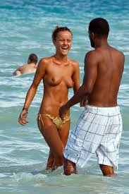 Candid beach teens topless enjoying sunbathing