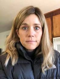 A mom finds support from another parent at school drop off