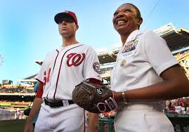 Blake Treinen, a pitcher for the Washington Nationals, discusses the  opening pitch procedure with Fleet Master Chief for Manpower, Personnel,  Training and Education April Beldo at Nationals Park in Washington D.C. -