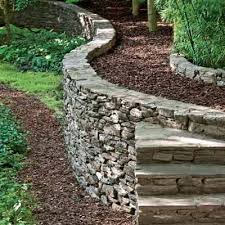 For the free standing wet wall, dig a trench a few inches wider than the base of the wall and to a depth of the frost level in the locality. 4 Tips To Building A Natural Stone Retaining Wall Magic Masonry