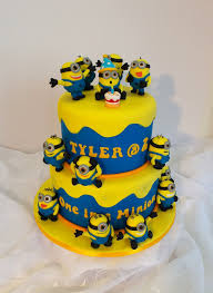 Making a minion cake is so much fun! Two Tier Minion Themed Birthday Cake Minion Birthday Cake Cake Birthday Cake For Cat