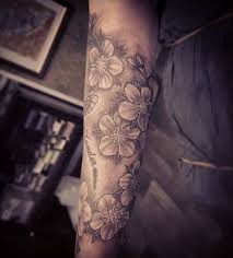 The cherry blossom tattoos on the leg #57. 250 Japanese Cherry Blossom Tattoo Designs With Meanings Symbolism 2021
