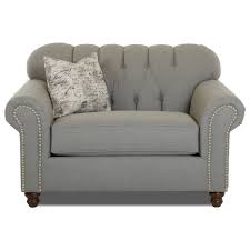 Not only is it quite large, but it also provides excellent stability thanks to its oversized seat and large feet. Klaussner Sinclair K13710 Bc Traditional Oversize Chair With Nailheads Catalog Outlet Chair A Half