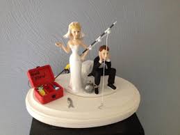 Each gun is decorated to represent the bride and groom.the guns are glued inside a tree bark stained wood chair. Cake Topper Funny Bridal Wedding Day Bride Groom Going Gone Hunting Theme