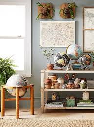Decorate your house with pillows, tapestries, mugs, blankets, clocks and more. 4 Inspiring Ways To Decorate With Maps And Globes Globe Decor Decor Minimalist Apartment Decor