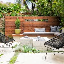 A freestanding block or stone patio wall is a functional and eye catching landscaping feature. Retaining Wall Ideas Sunset Magazine