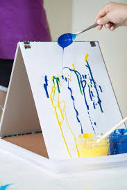 Soak a cotton ball in rubbing alcohol and rub it in a. Drip Painting With Kids At A Diy Cardboard Easel Explore Gravity In Art